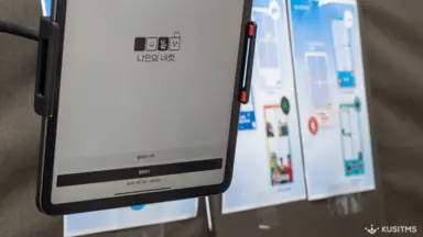 A my4cut tablet photo booth stand set up in an exhibition hall